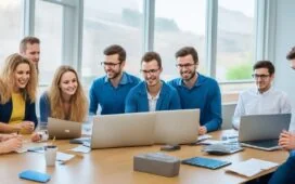 Ein warmes, sonnendurchflutetes Büro mit einem fokussierten, vielfältigen Team aus jungen Erwachsenen und älteren Menschen, die gemeinsam an Laptops arbeiten und sich mit freundlichen Gesten über innovative KI-Technologien austauschen – ein lebendiges Sinnbild für digitale Teilhabe und zukunftsweisende Zusammenarbeit in Großbritannien.
