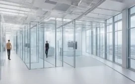 Ein hell erleuchtetes, modernes IT-Forschungszentrum mit transparenten Glaswänden, in dem engagierte Wissenschaftler in freundlicher Atmosphäre an leistungsstarken Serveranlagen und Hightech-Computern arbeiten, umgeben von natürlichem Tageslicht und warmen Holzakzenten, die innovative, nachhaltige digitale Infrastruktur greifbar machen.